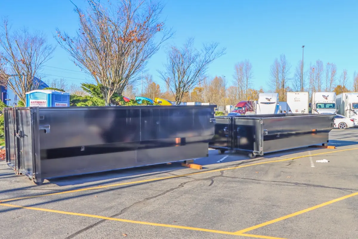 Professional dumpster rental service with roll-off container on residential driveway in Lucerne Valley